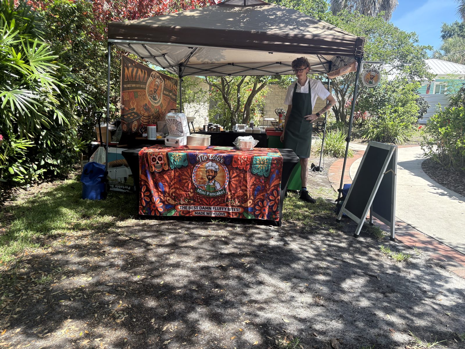 Tío Lolo's Mini Pancakes pop-up tent at an outdoor event